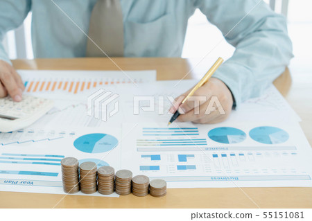 Businessman analyzing investment charts and Businessman analyzing investment charts and 55151081