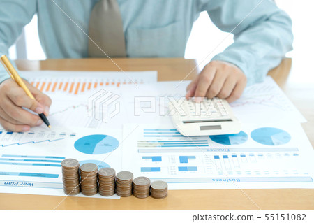 Businessman analyzing investment charts and Businessman analyzing investment charts and 55151082