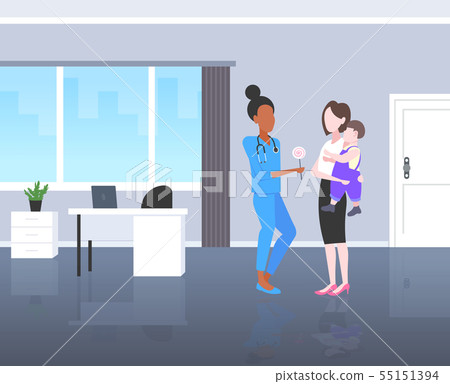 doctor pediatrician giving lollipop to little boy consultation healthcare concept mother holding doctor pediatrician giving lollipop to little boy consultation healthcare concept mother holding 55151394