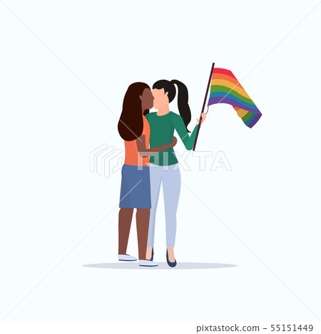 women couple holding rainbow flag girls kissing love parade lgbt pride festival concept mix race women couple holding rainbow flag girls kissing love parade lgbt pride festival concept mix race 55151449