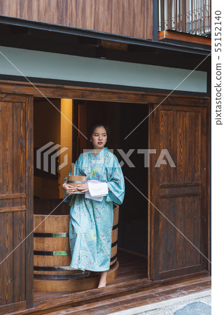 Lifestyle series: Woman holding wooden bucket Lifestyle series: Woman holding wooden bucket 55152140