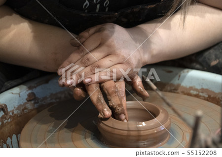hands while crafting pottery detail close up hands while crafting pottery detail close up 55152208