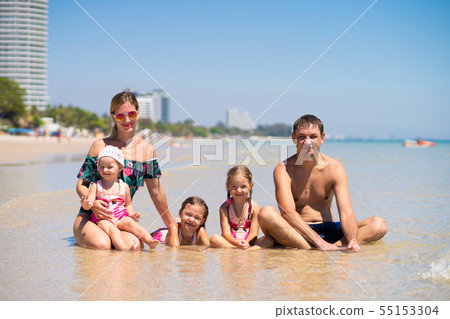 Big happy family is having fun at beach. concept of a large family at sea.beach fashion. 55153304