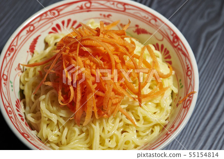Chinese noodles and carrots served in a bowl Chinese noodles and carrots served in a bowl 55154814