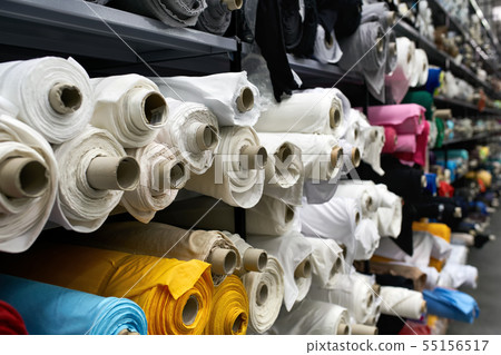 Fabric warehouse with many multicolored textile rolls Fabric warehouse with many multicolored textile rolls 55156517