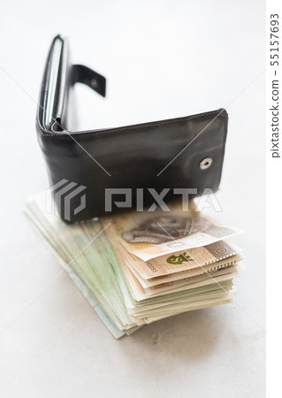 Black wallet with polish money on concrete table Black wallet with polish money on concrete table 55157693