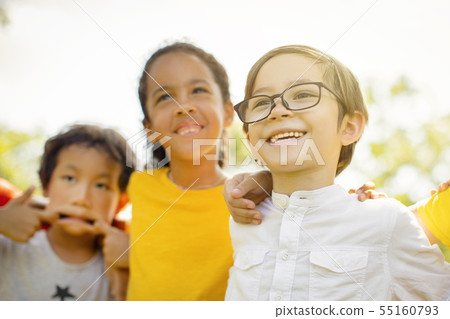 Multi-ethnic group of school kids laughing and 55160793