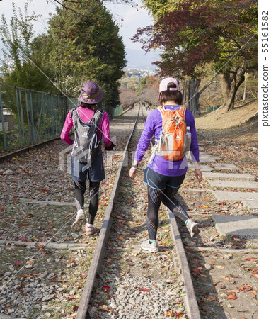 Female hiker going kicking an incline Female hiker going kicking an incline 55161582