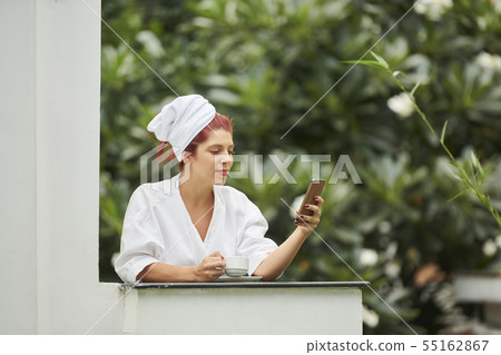 Pretty woman enjoying morning coffee 55162867