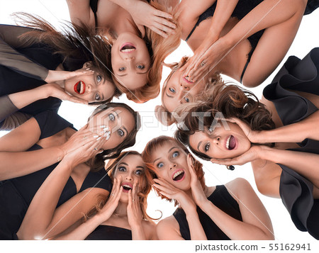 Bottom view of a group of happy amazed women. Surprized and looking down Bottom view of a group of happy amazed women. Surprized and looking down 55162941