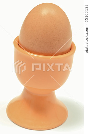 Boiled egg in orange cup. White background 55163152