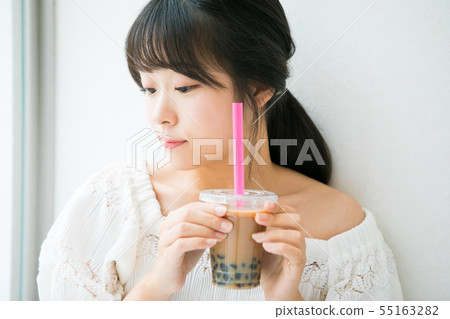 Tapioca milk tea and young girl Tapioca milk tea and young girl 55163282