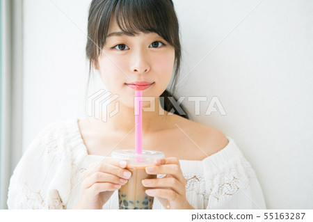 Tapioca milk tea and young girl Tapioca milk tea and young girl 55163287