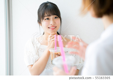Young girls drinking tapioca milk tea Young girls drinking tapioca milk tea 55163305