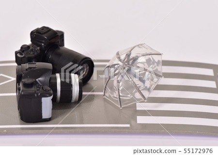 Road, camera and umbrella 55172976