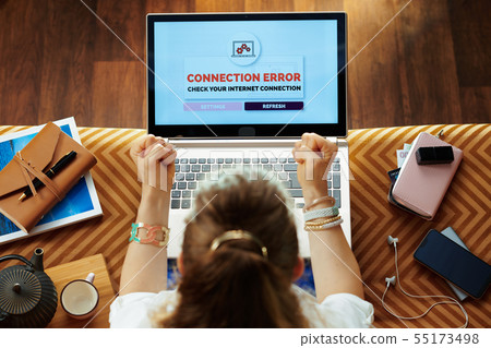 furious modern housewife having connection failure on laptop furious modern housewife having connection failure on laptop 55173498