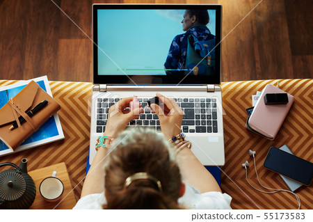 elegant woman watching movie on laptop and polish nail 55173583