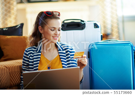 elegant woman with credit card booking tickets elegant woman with credit card booking tickets 55173660