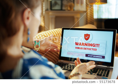 furious young housewife having virus on computer 55173678