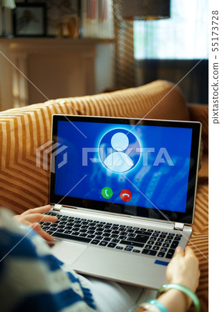 modern woman having video chat on computer on laptop modern woman having video chat on computer on laptop 55173728