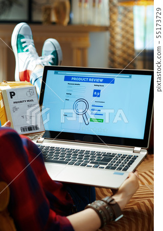 hipster with parcel writing review after online shopping hipster with parcel writing review after online shopping 55173729