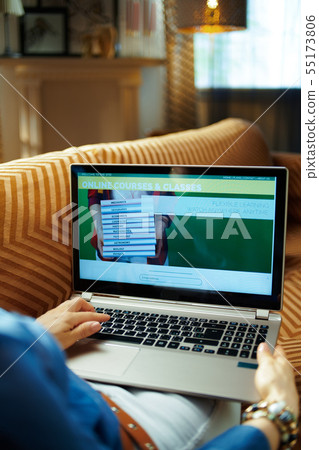 housewife using video learning website on laptop housewife using video learning website on laptop 55173806