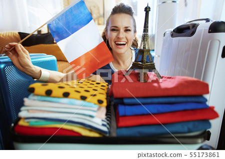 traveller woman showing French flag and Eiffel tower souvenir 55173861