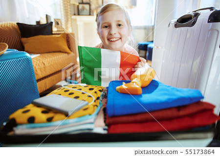 happy young traveller child showing Italian Flag 55173864