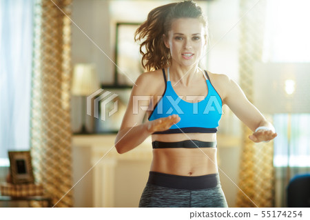 active sports woman workout and using heart rate monitor 55174254