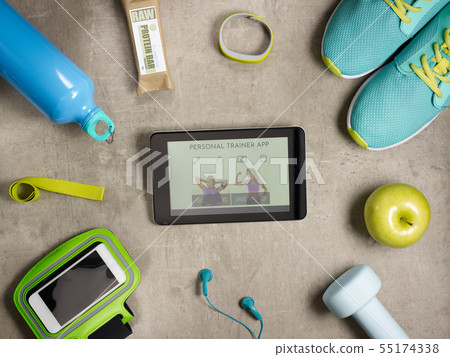 Closeup on sneakers and tablet PC with personal trainer app 55174338