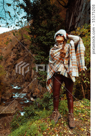 happy stylish woman hiker in forest enjoying promenade happy stylish woman hiker in forest enjoying promenade 55175208