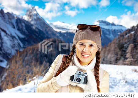 traveller woman with retro photo camera in Alto Adige, Italy 55175417