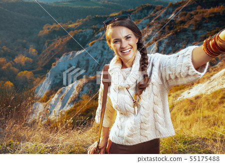 smiling woman hiker on summer Tuscany trekking taking selfie 55175488