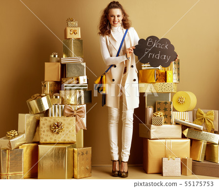 happy elegant fashion-monger with Black Friday sign happy elegant fashion-monger with Black Friday sign 55175753