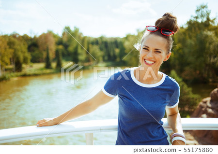 smiling modern tourist woman on river boat having river voyage 55175880