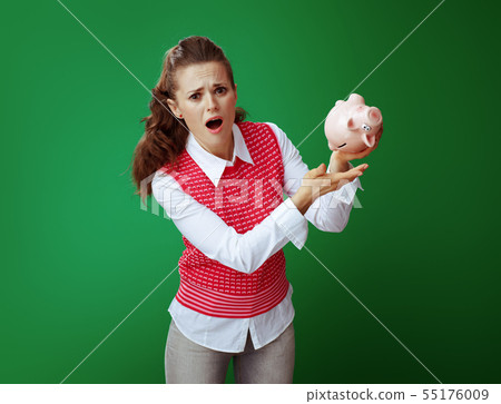 stressed young student woman shaking pink piggy bank stressed young student woman shaking pink piggy bank 55176009