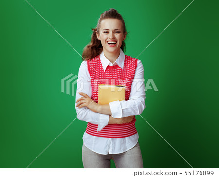 happy student holding yellow book isolated on green background happy student holding yellow book isolated on green background 55176099
