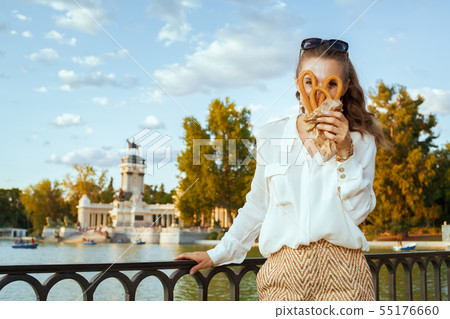 traveller woman looking through traditional Spain churro traveller woman looking through traditional Spain churro 55176660