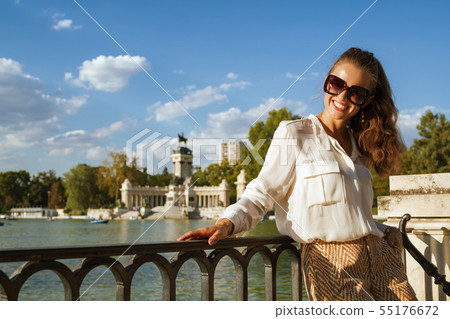 happy trendy traveller woman in Madrid, Spain happy trendy traveller woman in Madrid, Spain 55176672