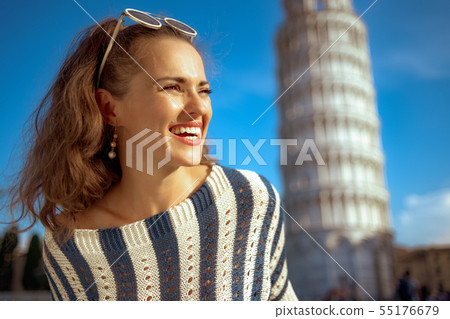 woman near leaning tower in Pisa, Italy looking into distance woman near leaning tower in Pisa, Italy looking into distance 55176679