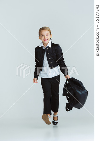 Girl preparing for school after a long summer break. Back to school. Girl preparing for school after a long summer break. Back to school. 55177843
