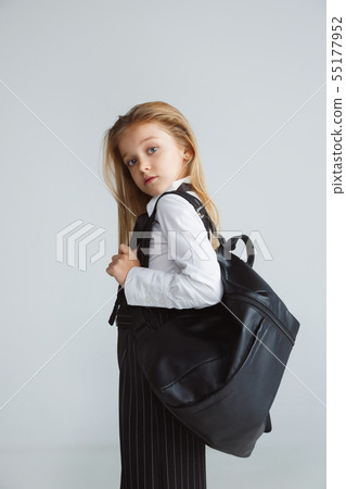 Girl preparing for school after a long summer break. Back to school. Girl preparing for school after a long summer break. Back to school. 55177952