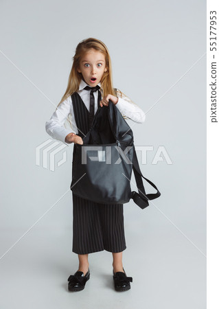 Girl preparing for school after a long summer break. Back to school. Girl preparing for school after a long summer break. Back to school. 55177953