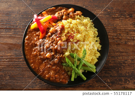 Curry of pickled asparagus paprika with saffron rice and summer vegetables Curry of pickled asparagus paprika with saffron rice and summer vegetables 55178117