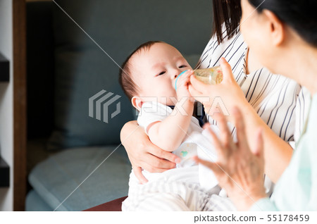 Baby drinking milk with mammal Baby drinking milk with mammal 55178459