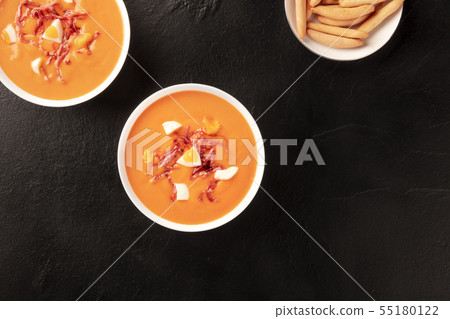 Salmorejo, Spanish cold soup, shot from above on a black background Salmorejo, Spanish cold soup, shot from above on a black background 55180122