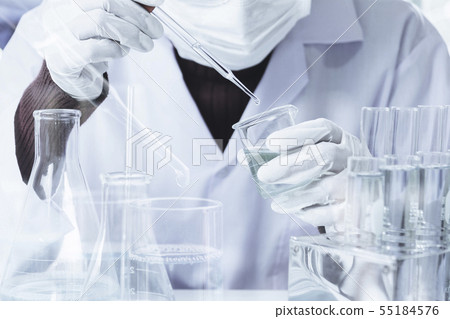 Researcher with glass laboratory chemical test 55184576