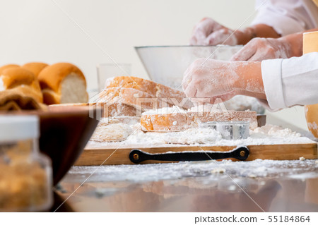 Mom teaching kid for cook food.  55184864