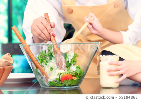 Happy family in the kitchen. Mom teaching kid Happy family in the kitchen. Mom teaching kid 55184865