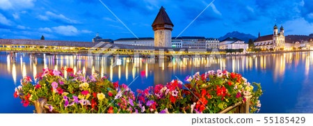Lucerne. The famous Chapel, Kapellbrucke bridge at dawn in night lighting. Lucerne. The famous Chapel, Kapellbrucke bridge at dawn in night lighting. 55185429